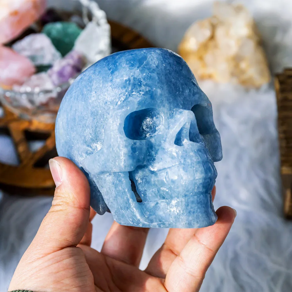 Wholesale natural high quality healing hand craved blue calcite crystal skulls crafts for home decoration