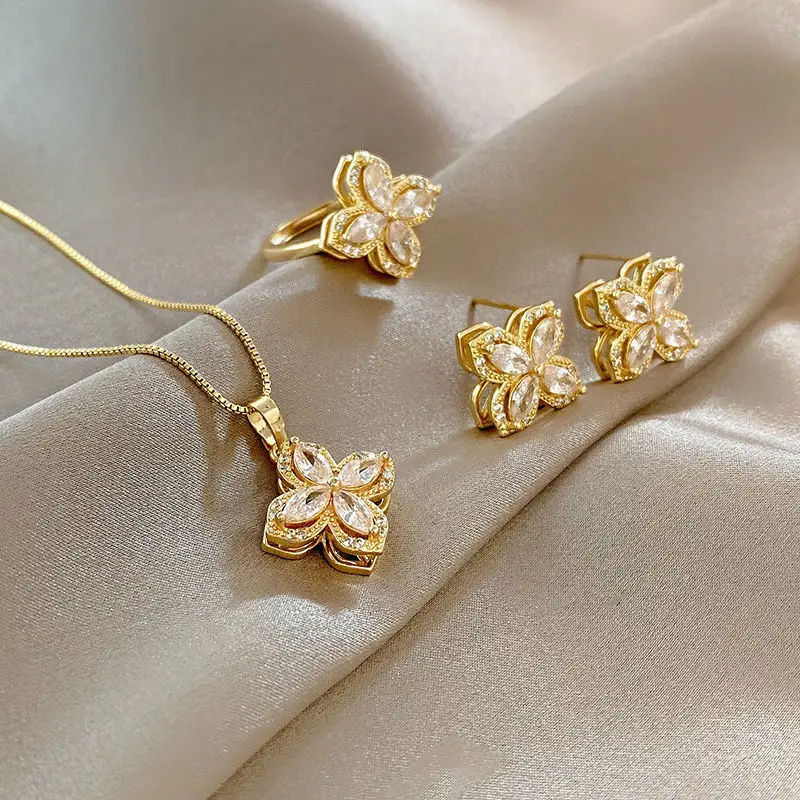 2023 Gold Plated Rotatable Four-leaf Clover Steel Chain Necklace Ring Pinwheel Stud Earrings Set