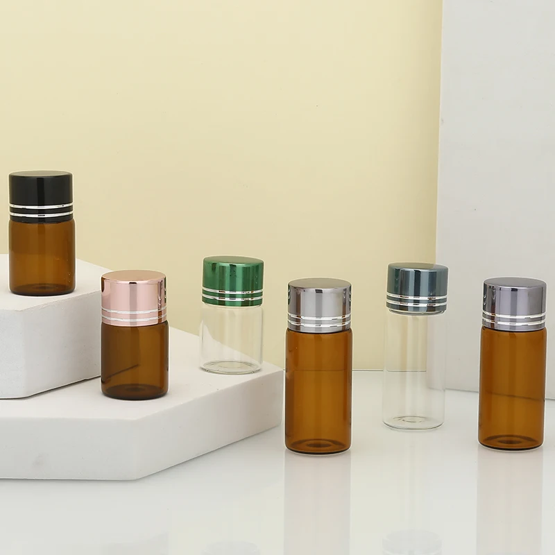 Jingtuo Hot Sale Clear Amber 1ml 2ml 3ml 4ml 5ml Mini Small Essential Oil Sample Glass Vials Bottle With Gold Metal Screw Cap