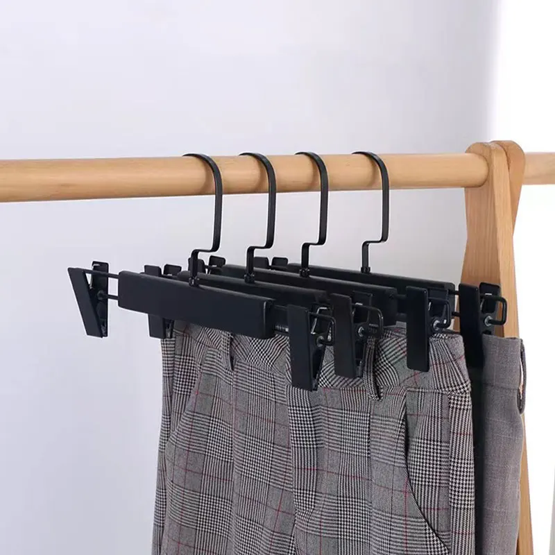 A large number of brands customize the production of logo black solid wood clothing pants rack with hanging clip skirt hanger