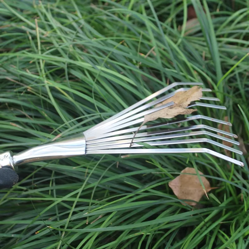 Stainless steel three toothed rake and flower