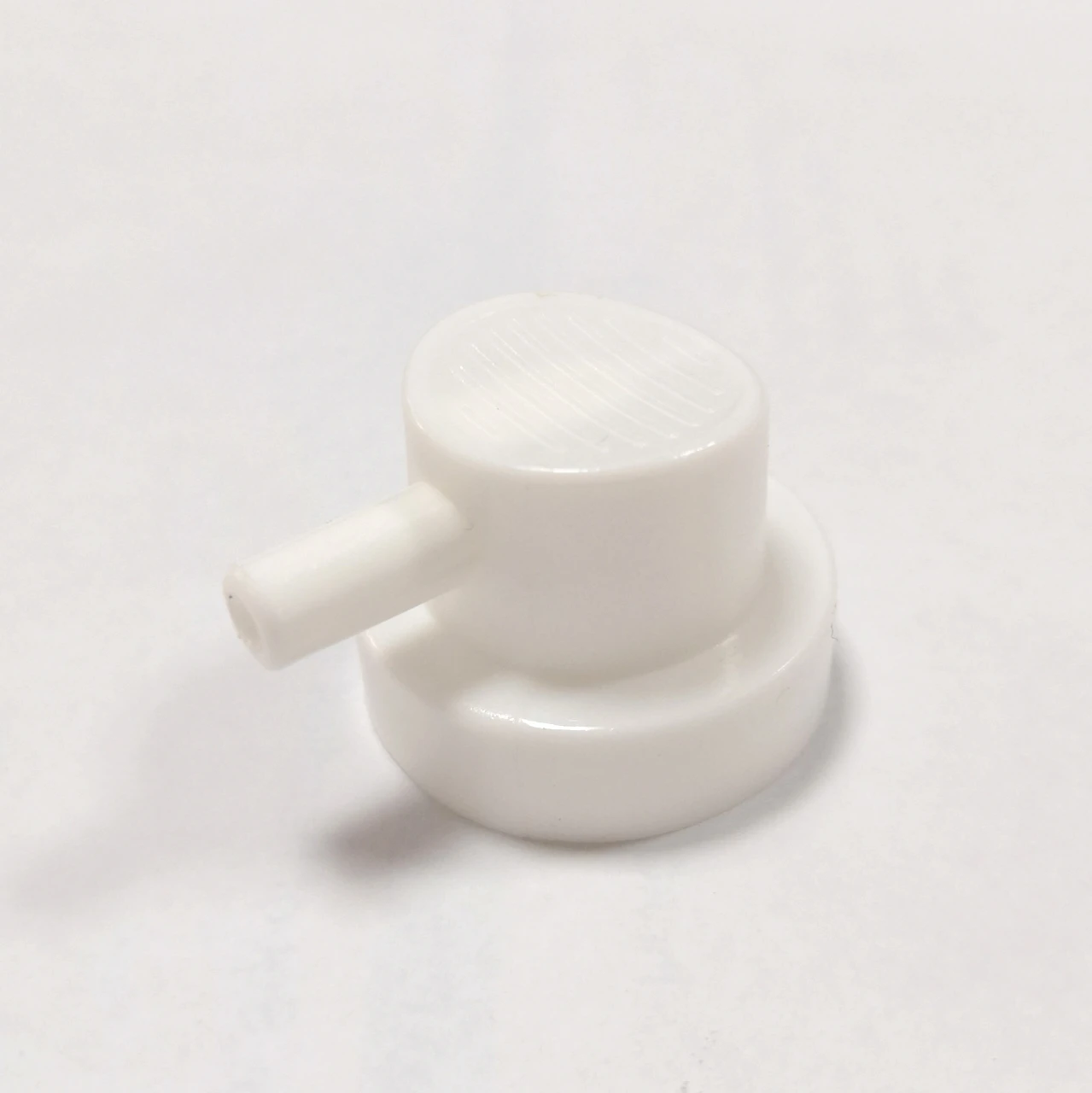 Male actuator with copper insert for female valve or female bag on valve