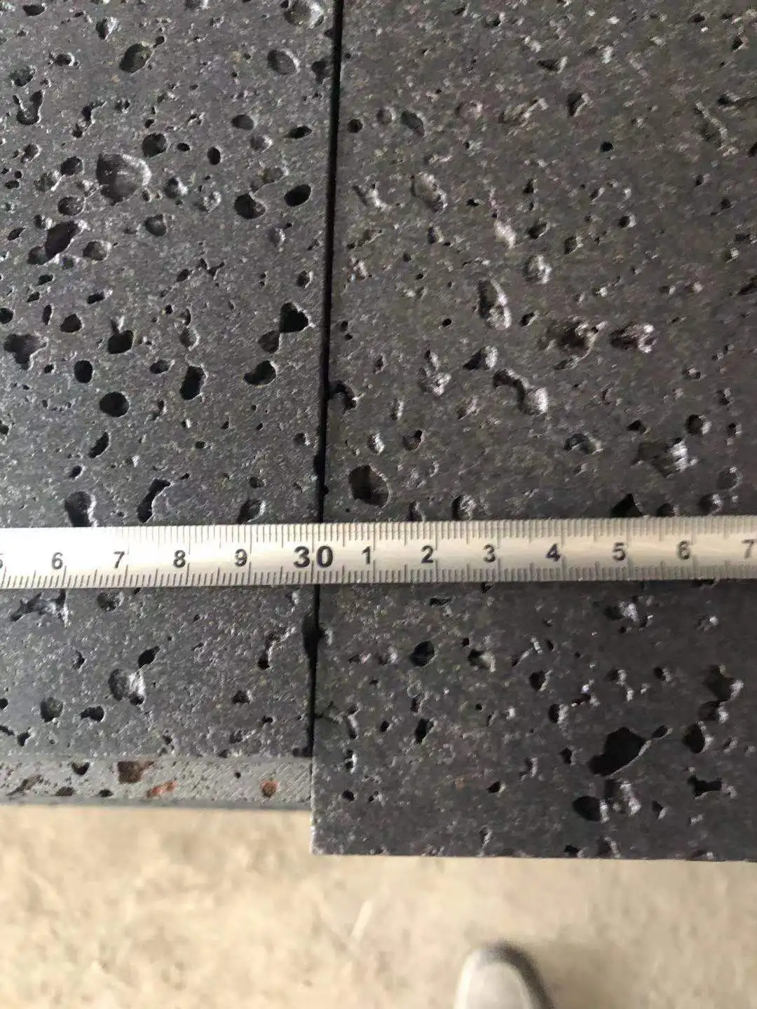 Customized Honed Finish Big Hole Type China Volcanic Black Basalt Lava Stone Slabs And Tiles