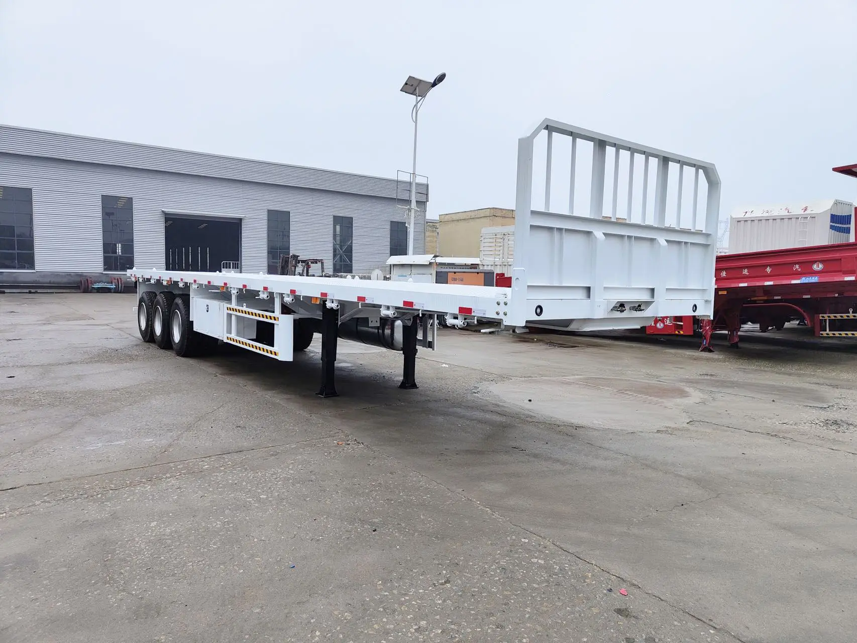 China Factory Lowest price New 3/4 Axle Flatbed Container Heavy Duty Cargo Transport with Front Wall and Lock Semi Trailer