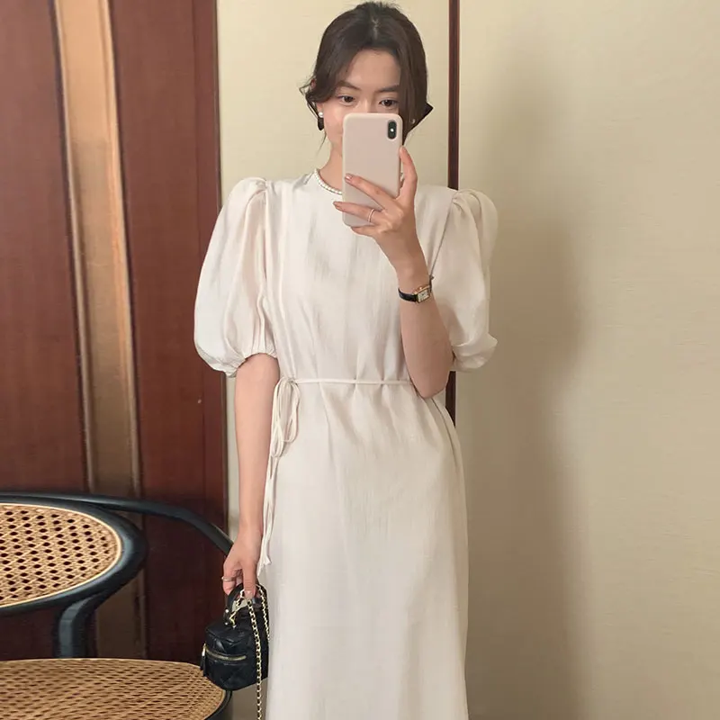 Wholesale 2023 South Korea Soft Green Round Neck Hollow-out Backless Lace Up Waist Solid Color Bubble Sleeve Dress