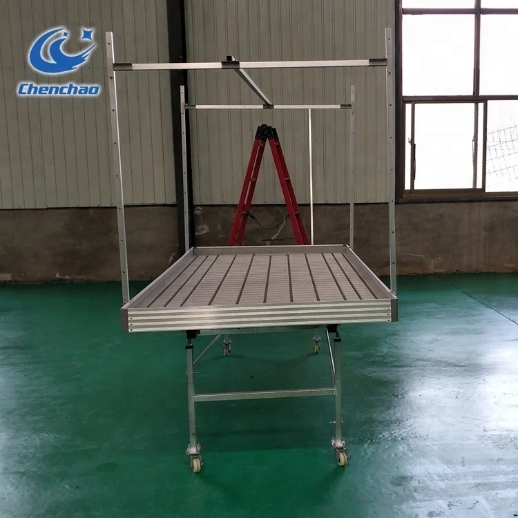 Greenhouse Structure With Flood And Drain Hydro Table