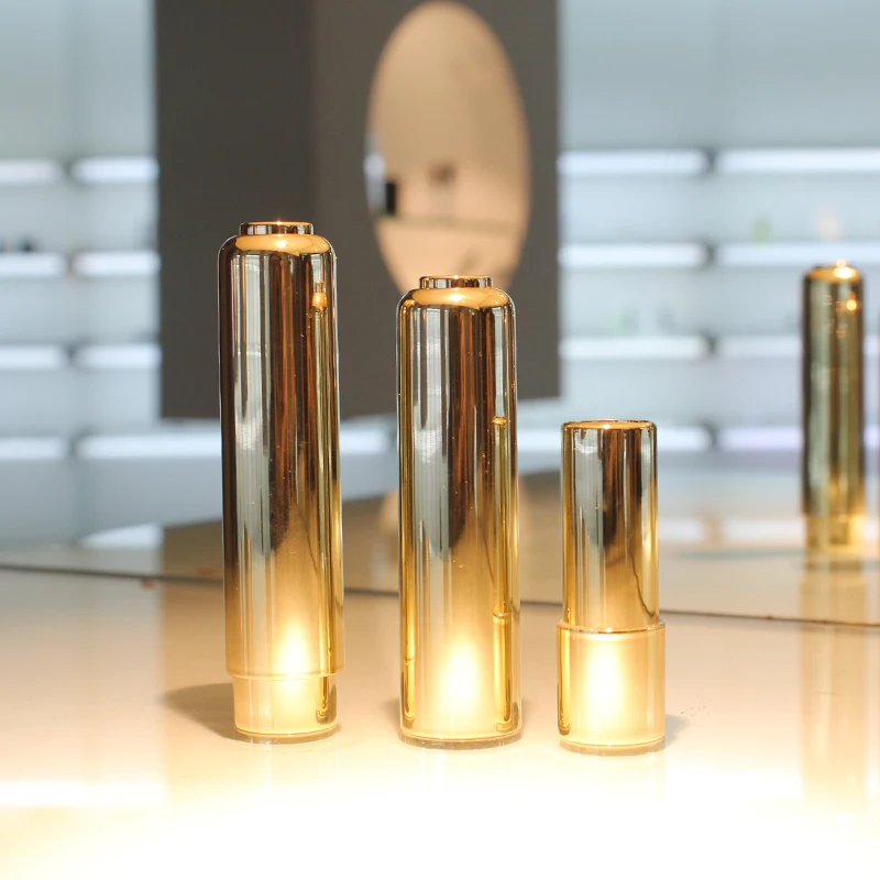 Wholesale luxury lipstick tube gold round shape lipstick container plastic lipstick packaging with customized logo