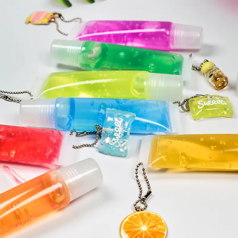 Logo free lip gloss keychain fruit flavor fading lip lines rainbow moisturizing lip gloss