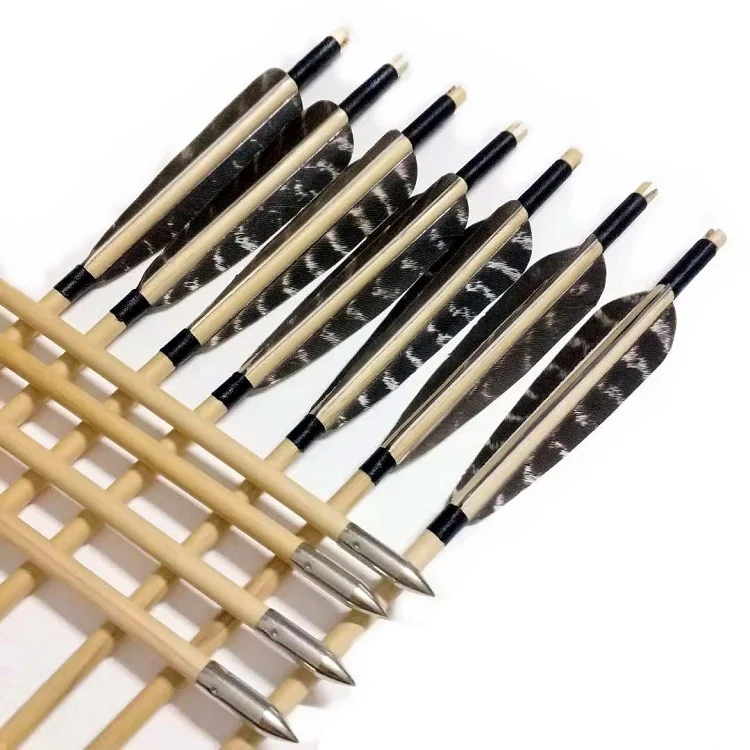 wooden arrow with turkey feather for traditional archery bow hunting and shooting