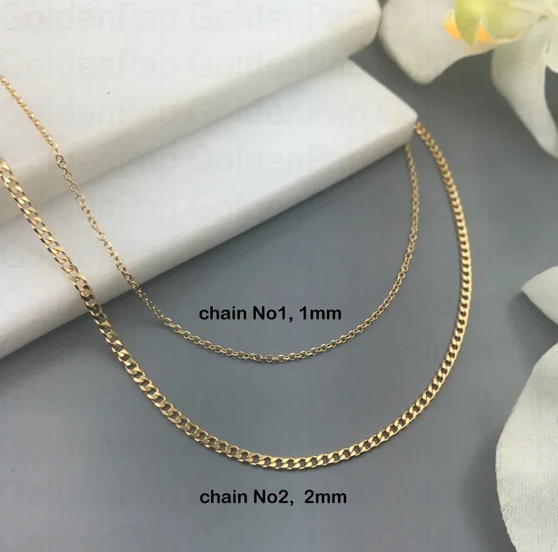 14k solid gold cross with real rubies