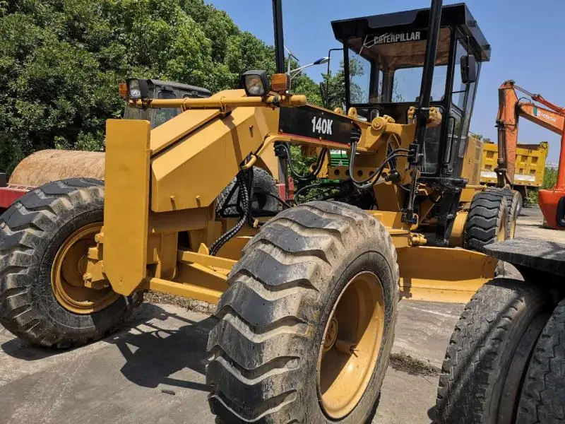 Подержанный автогрейдер cat 140k по хорошей цене