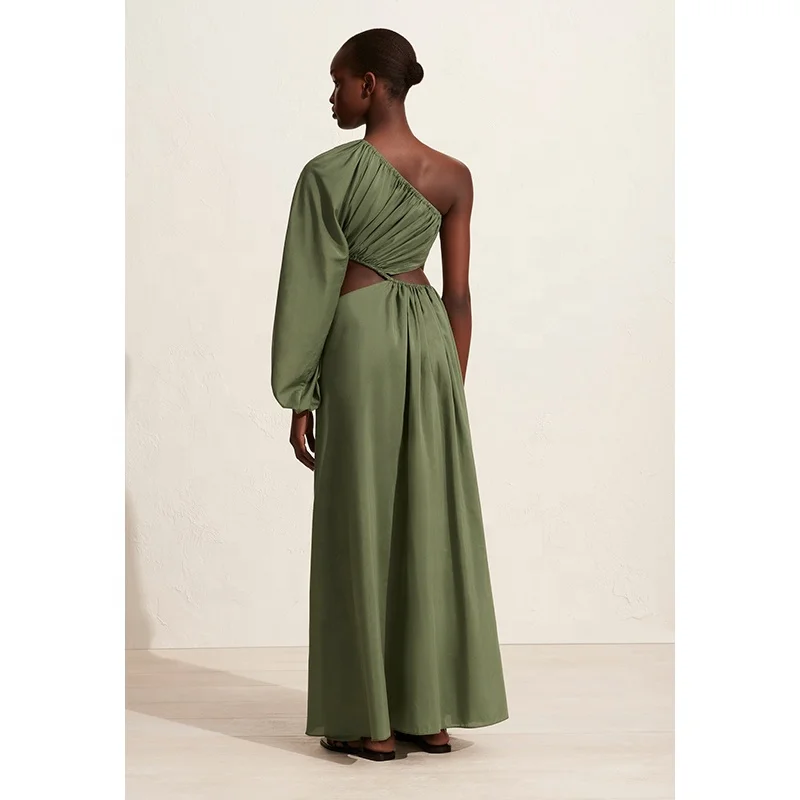 Women asymmetric full-length dress with bold waist cut-outs and a single voluminous long sleeve organic cotton maxi dress