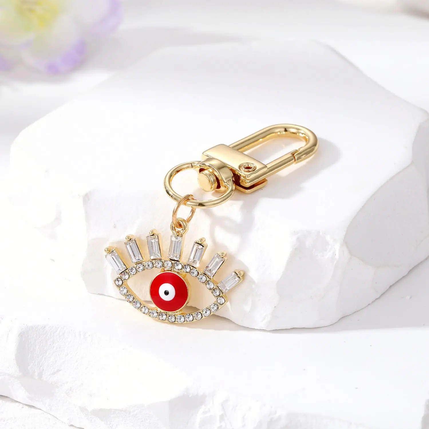 Cross-border e-commerce ornament hollow diamond eyelash eye keychain alloy geometric oil dripping Devil eye ornaments