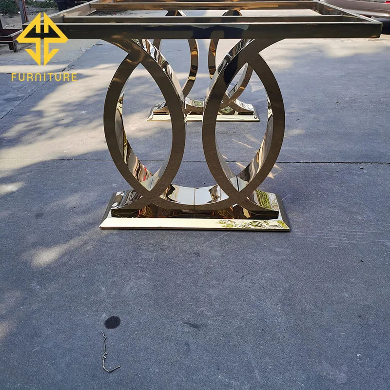 Foshan factory sells new design stainless steel golden dining table at low price, which can be matched with glass table and marb