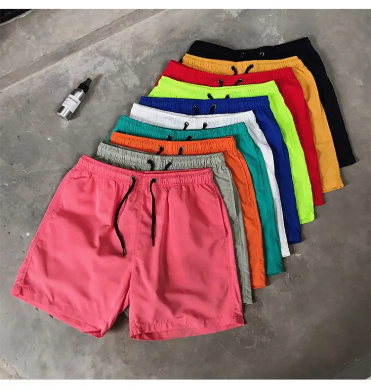 Wholesale stock  beach shorts polyester men running shorts mesh lining shorts for men with letter printing for promotion