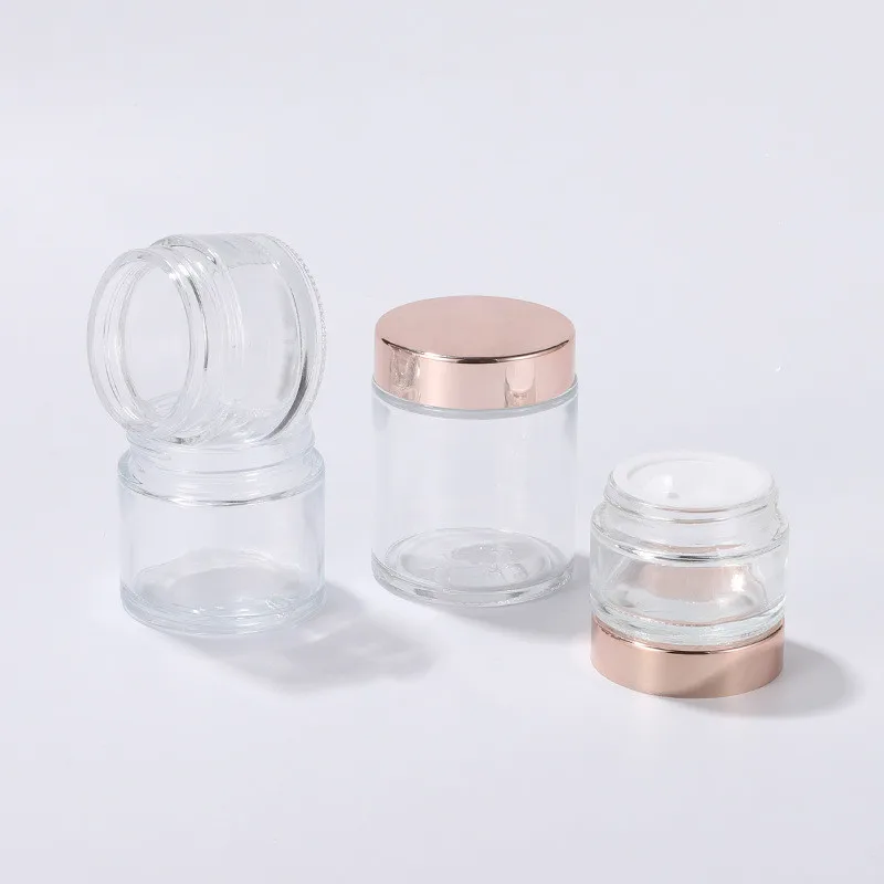 
cosmetic cream clear glass 50ml jar with silver gold and rose gold covers 