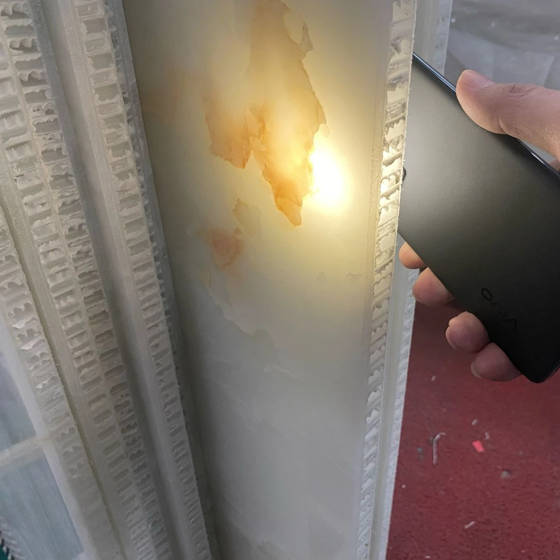 Translucent onyx panels with  honeycomb composite stone board for background and bar top