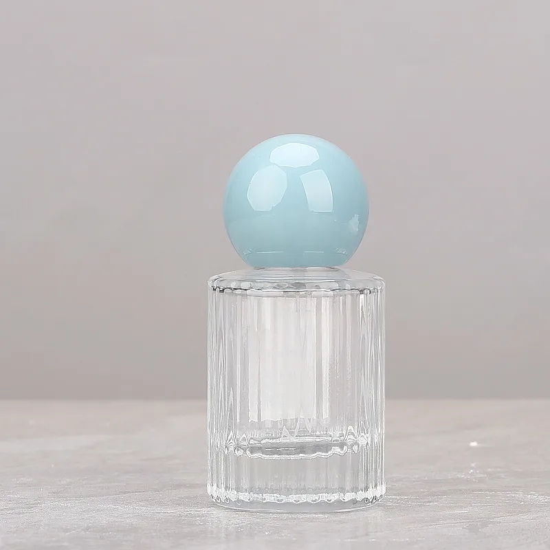 Wholesale 30ml Cylinder Fragrance Glass Bottle 50ml Transparent Vertical Line Round Perfume Spray Bottle with Round Ball Cap