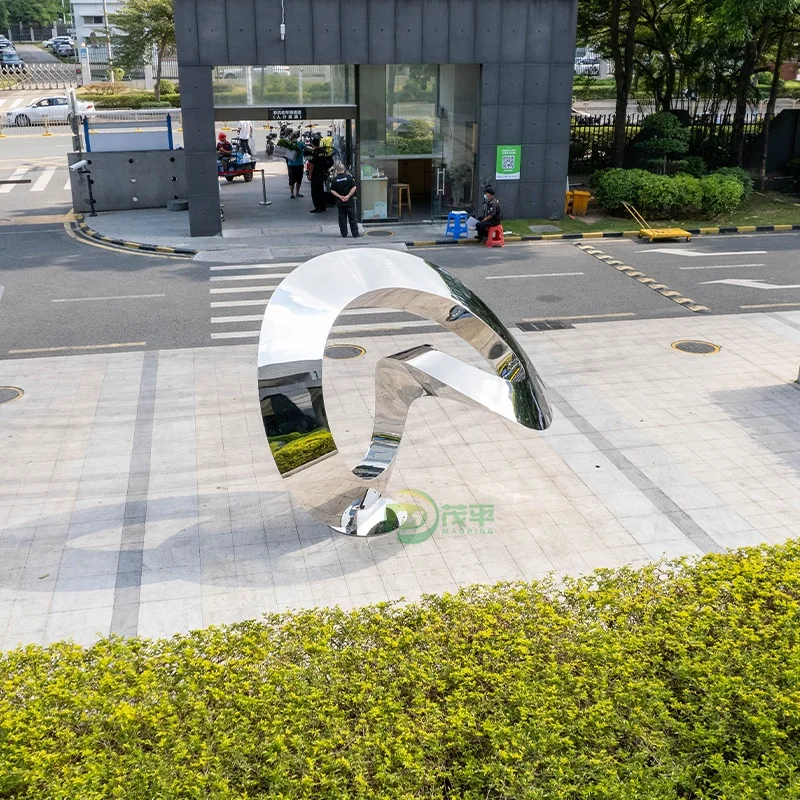 Large stainless steel sculpture in the park business square