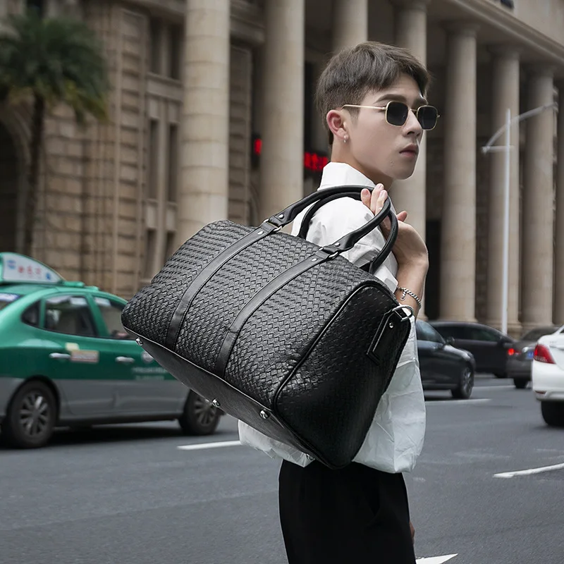 Fashion luggage bag woven PU leather black travel duffel bag for unisex duffel bags