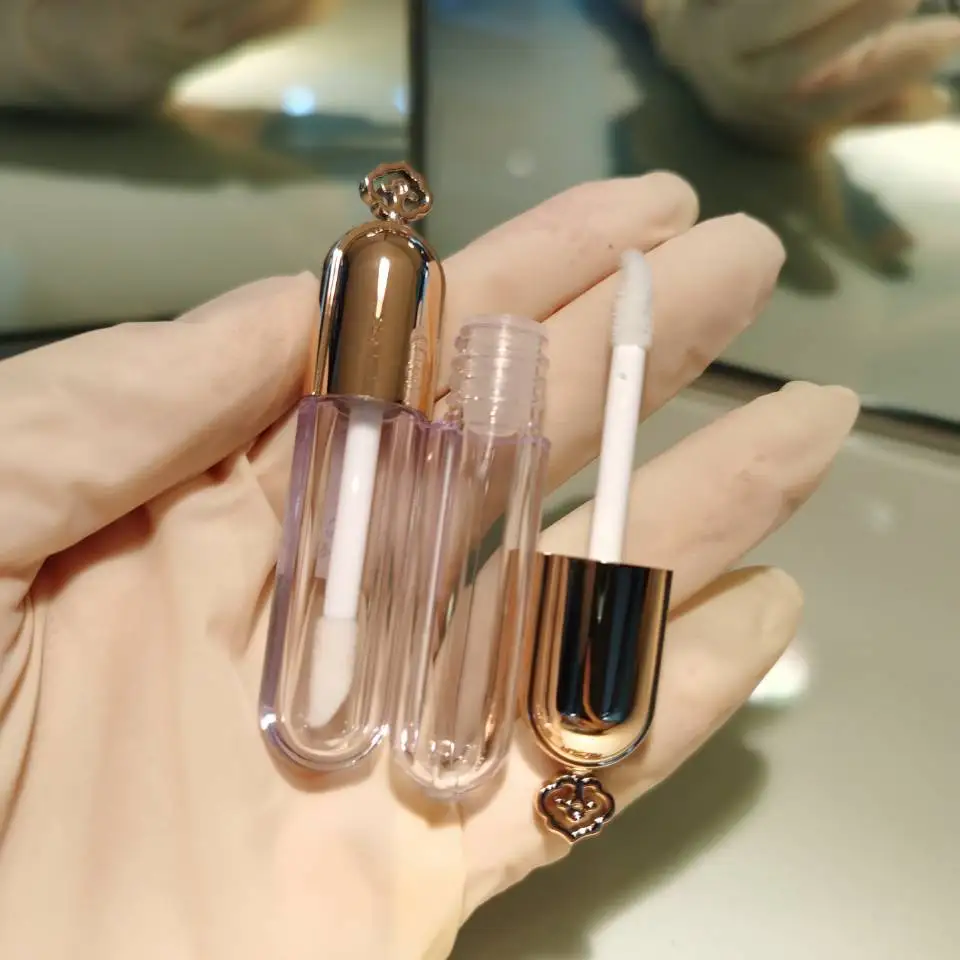 Liquid lipgloss tube 2022 unique 1.5ml gold lip gloss container empty crown mini keychain lip gloss tubes with  wands