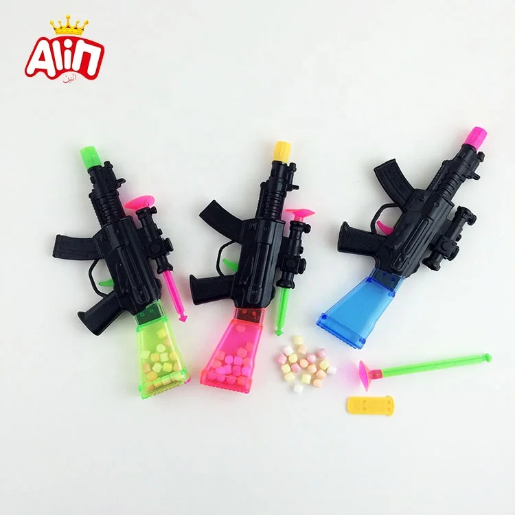 Toy gun contains mini ball fruit flavored hard candy toy candy