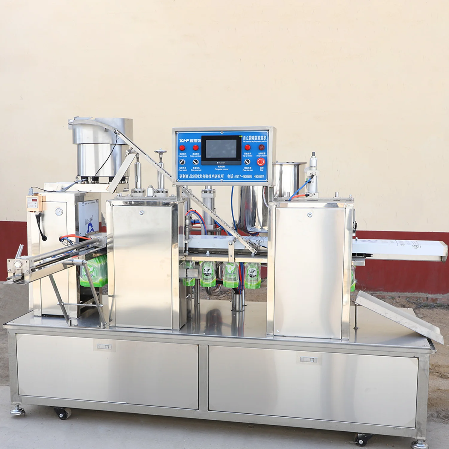 Full automatic 4 nozzle standing pouch juice soy milk plastic bag filling packaging machine factory juice filling equipment