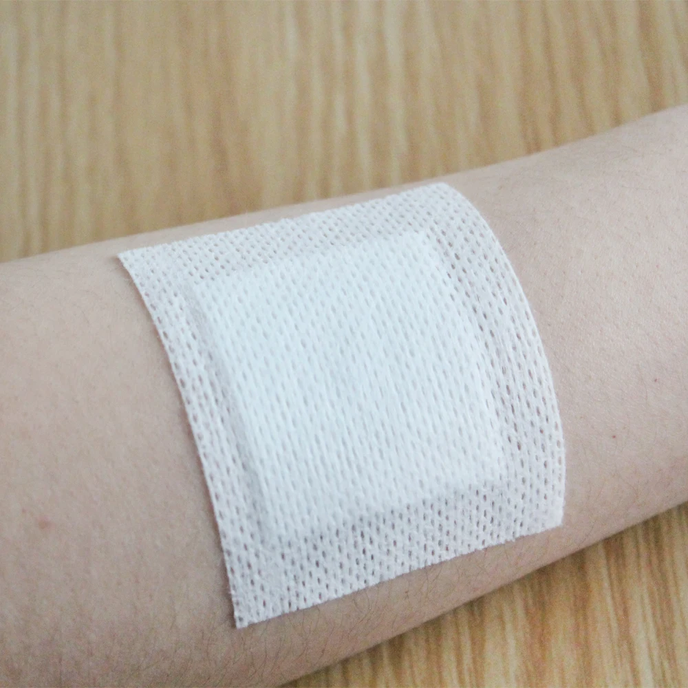 Medical Non-woven Dressing Roll Retention Adhesive Breathable Tape Non-Woven Tape Adhesive Dressing Roll