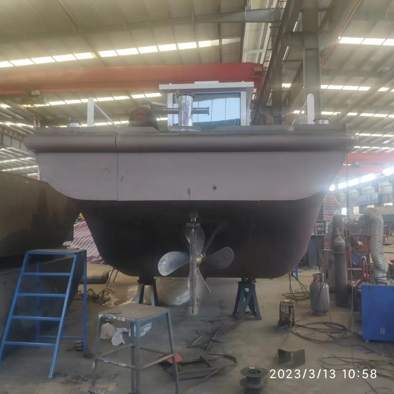 Lake construction project work boat with crane and implements tools