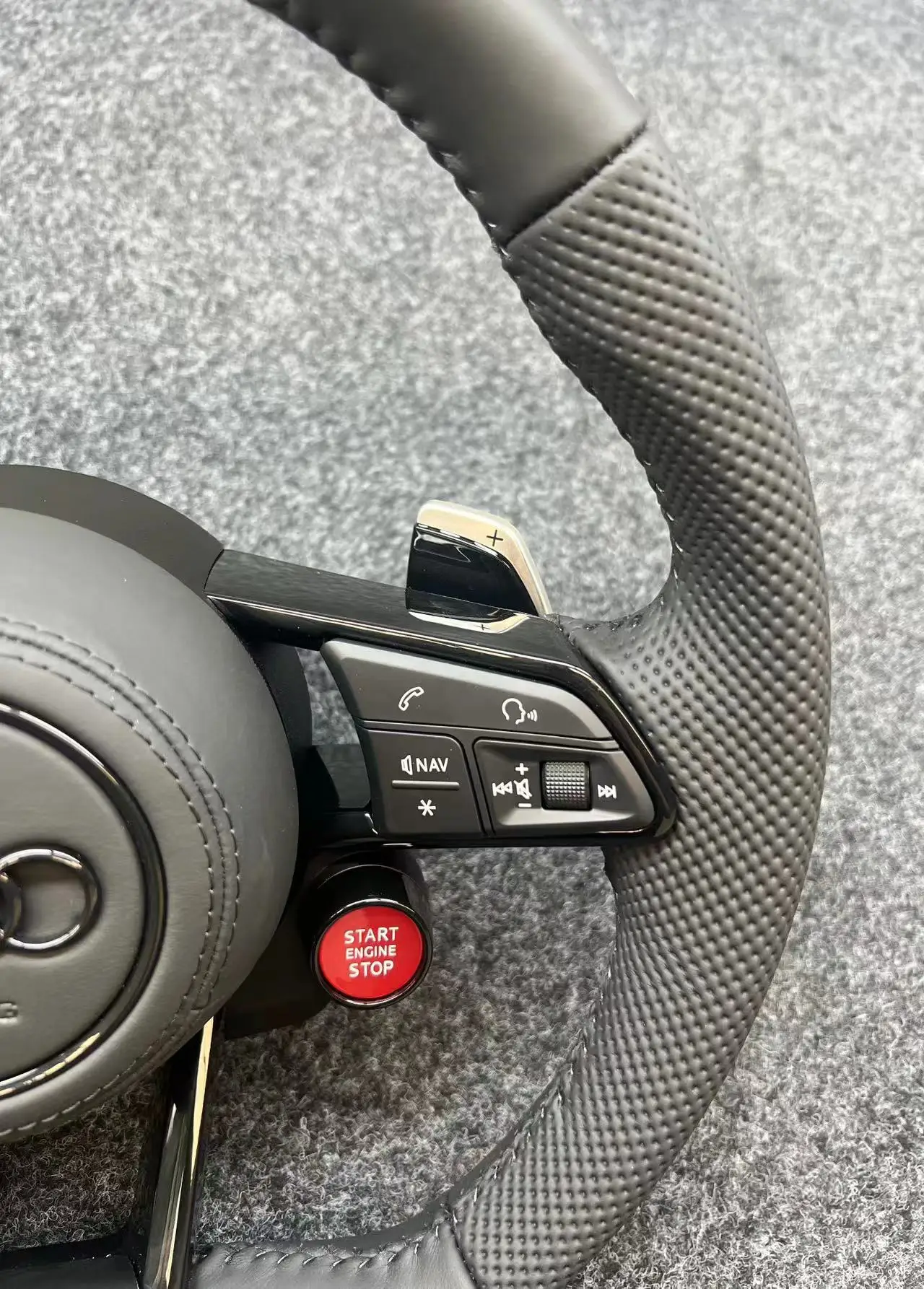 The Audi R8 steering wheel assembly upgrade R8 button sport mode is suitable for all new and old models