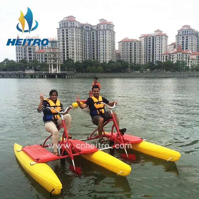 floating boat able to cycle on water mounted on two floats, recreational and competitive activity using water bike