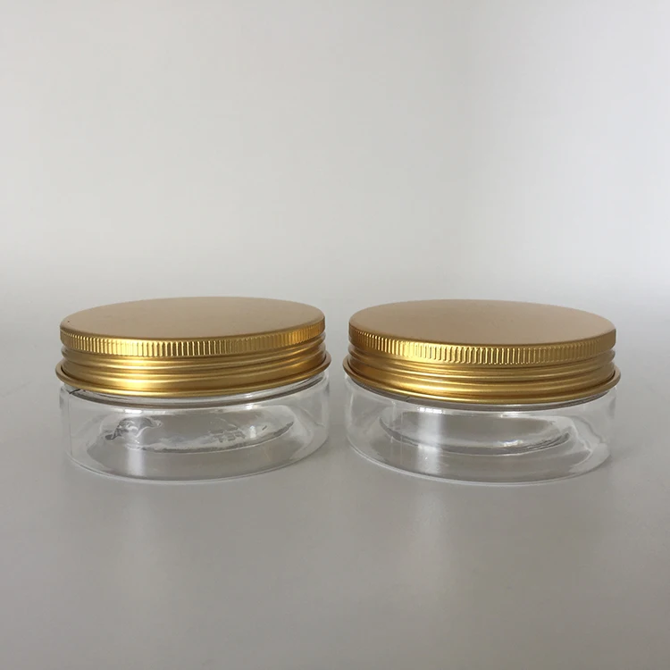 Empty 60ml 2 oz round plastic PET clear jar with gold aluminium screw lid and pressure seal for cosmetic, food packing