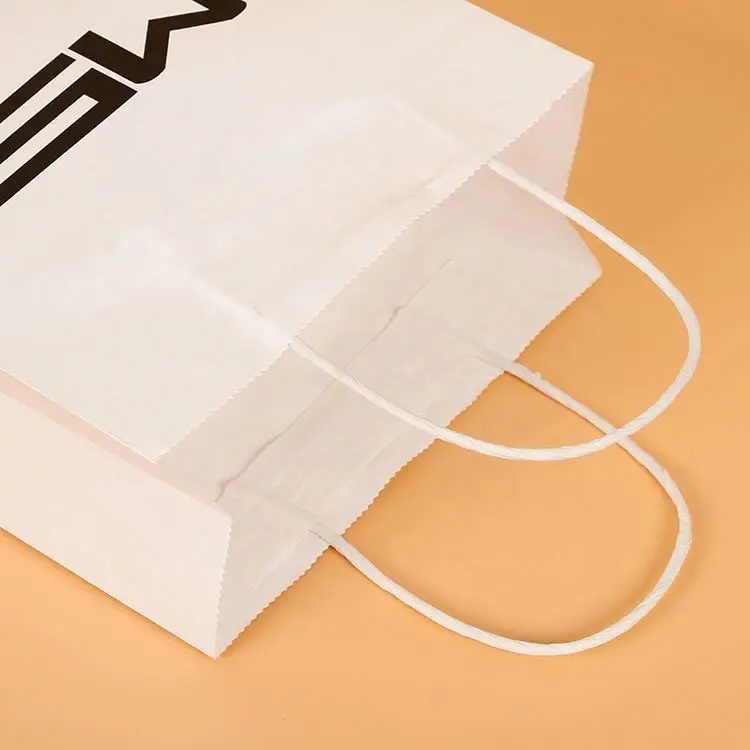 Customized 120gsm Thin White Kraft Shopping Cloth Paper Bag With Custom Printing