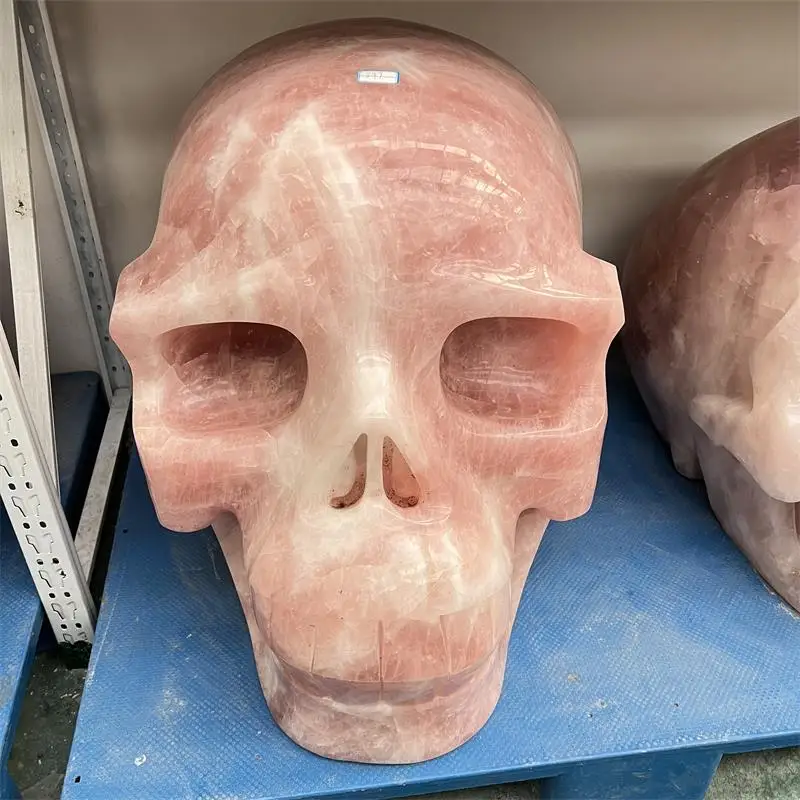 Hot sale natural high quality large size rose quartz crystal head carvings reiki pink crystal skulls for home decoration