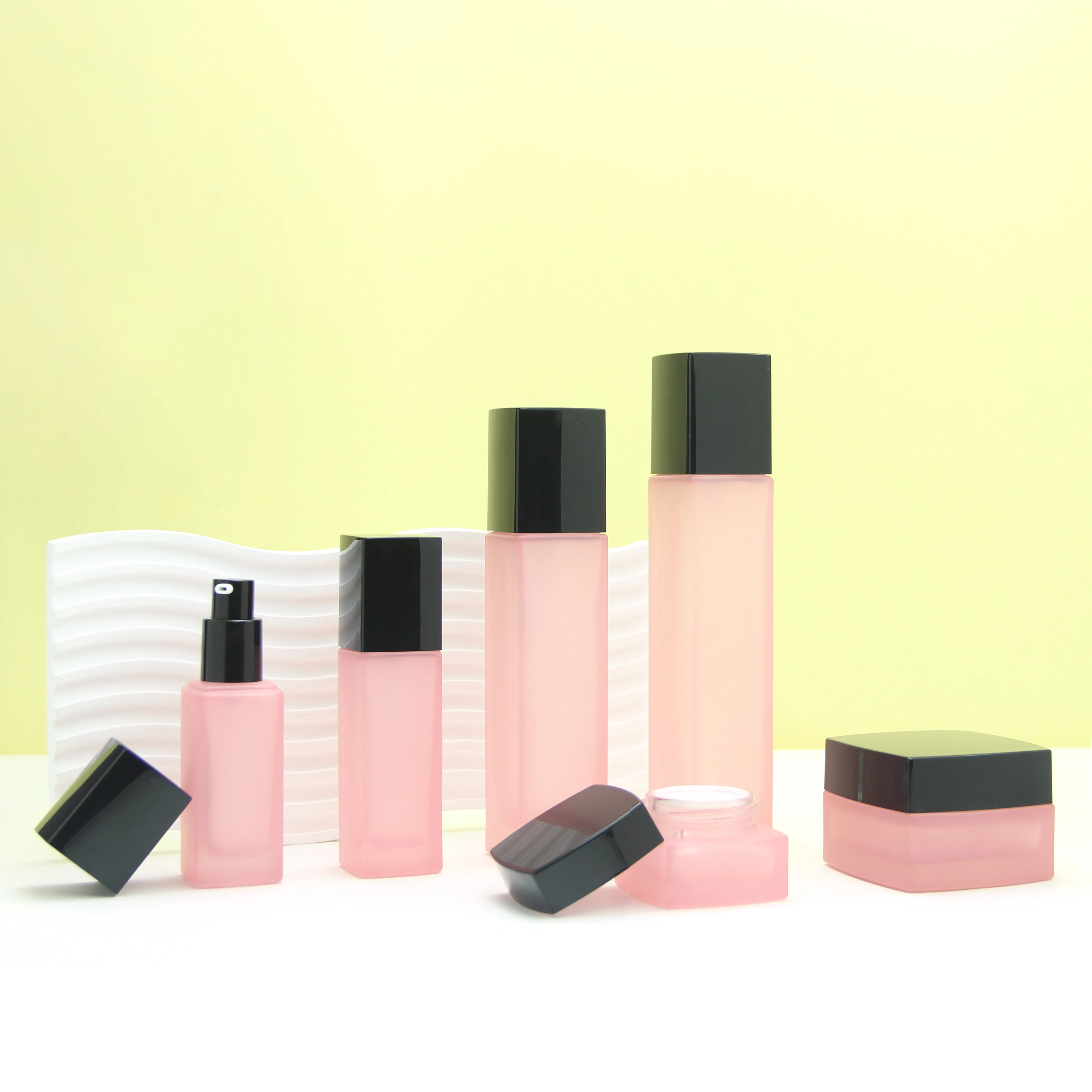 Wholesale cosmetic packaging set square matte pink empty body oil serum pump bottle and glass jars with lids