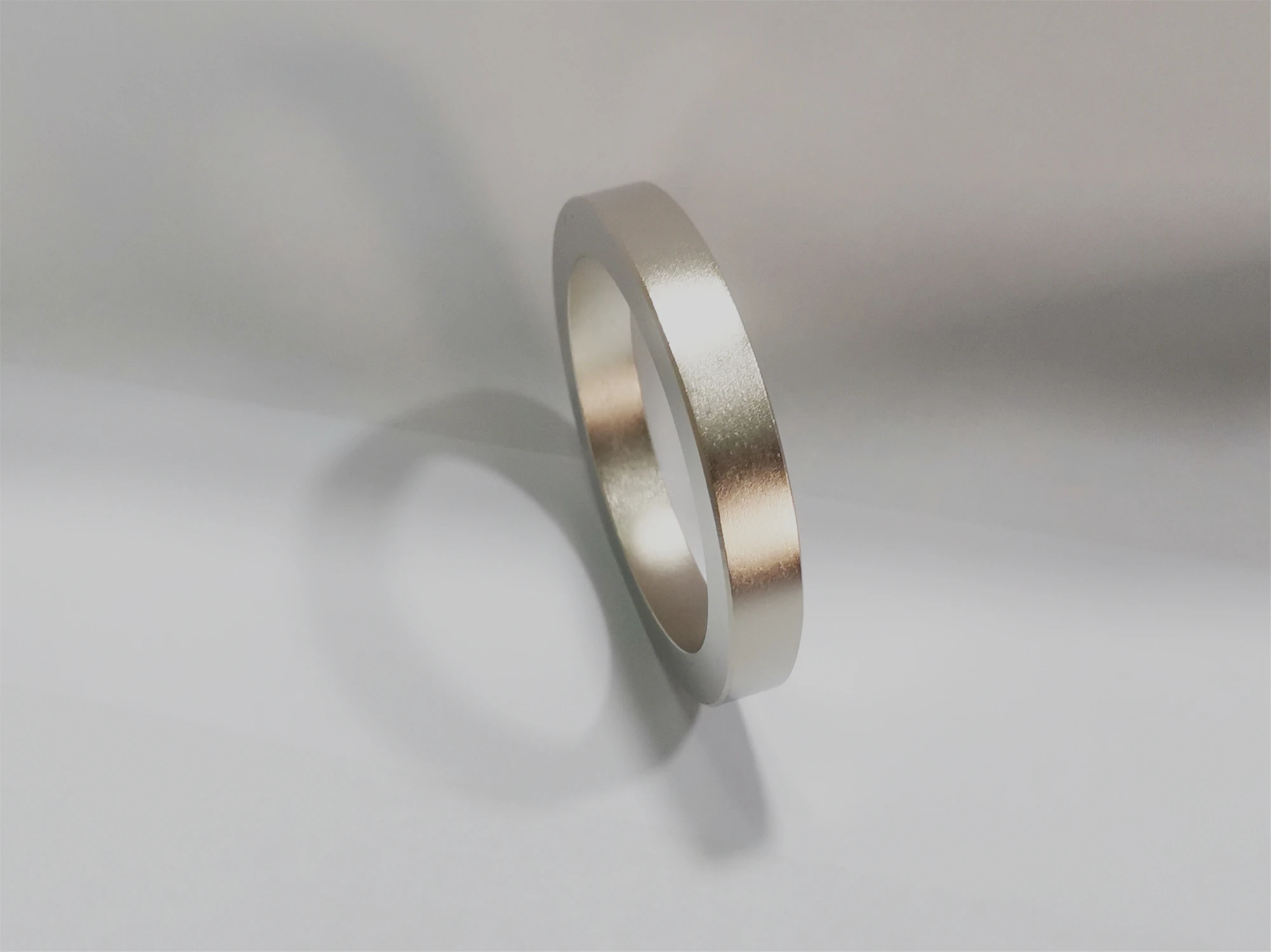 Radially oriented annular sintered neodymium rare earth permanent magnet ring magnet