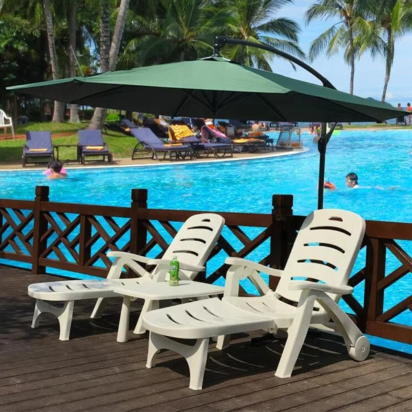 Outdoor beach hotel swimming pool plastic chaise lounge chair