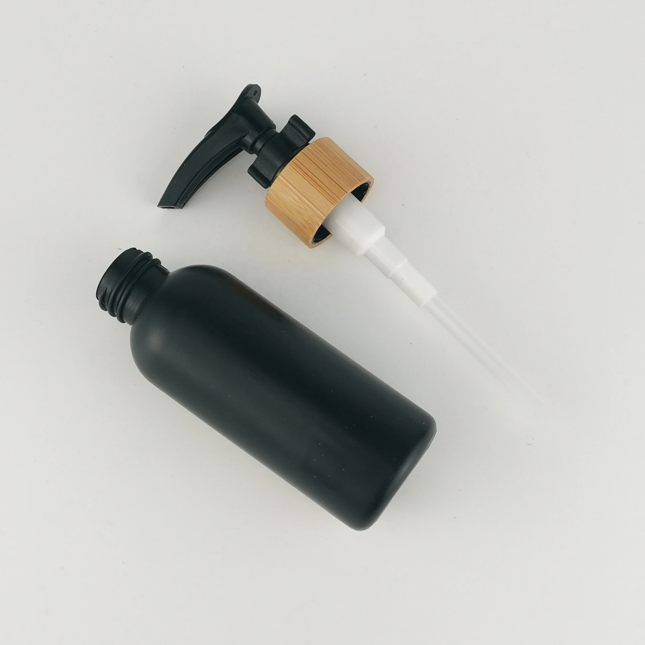 60 ml matte black bottles 2 ounce plastic HDPE bottle with bamboo closures for cosmetic packaging