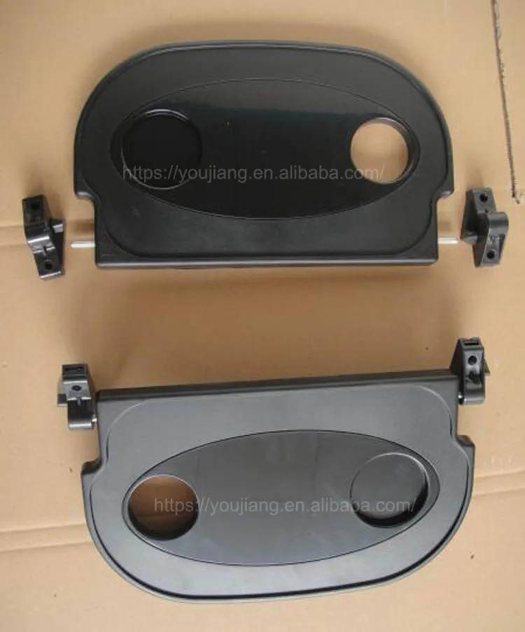 Folding plastic tray table for bus seat