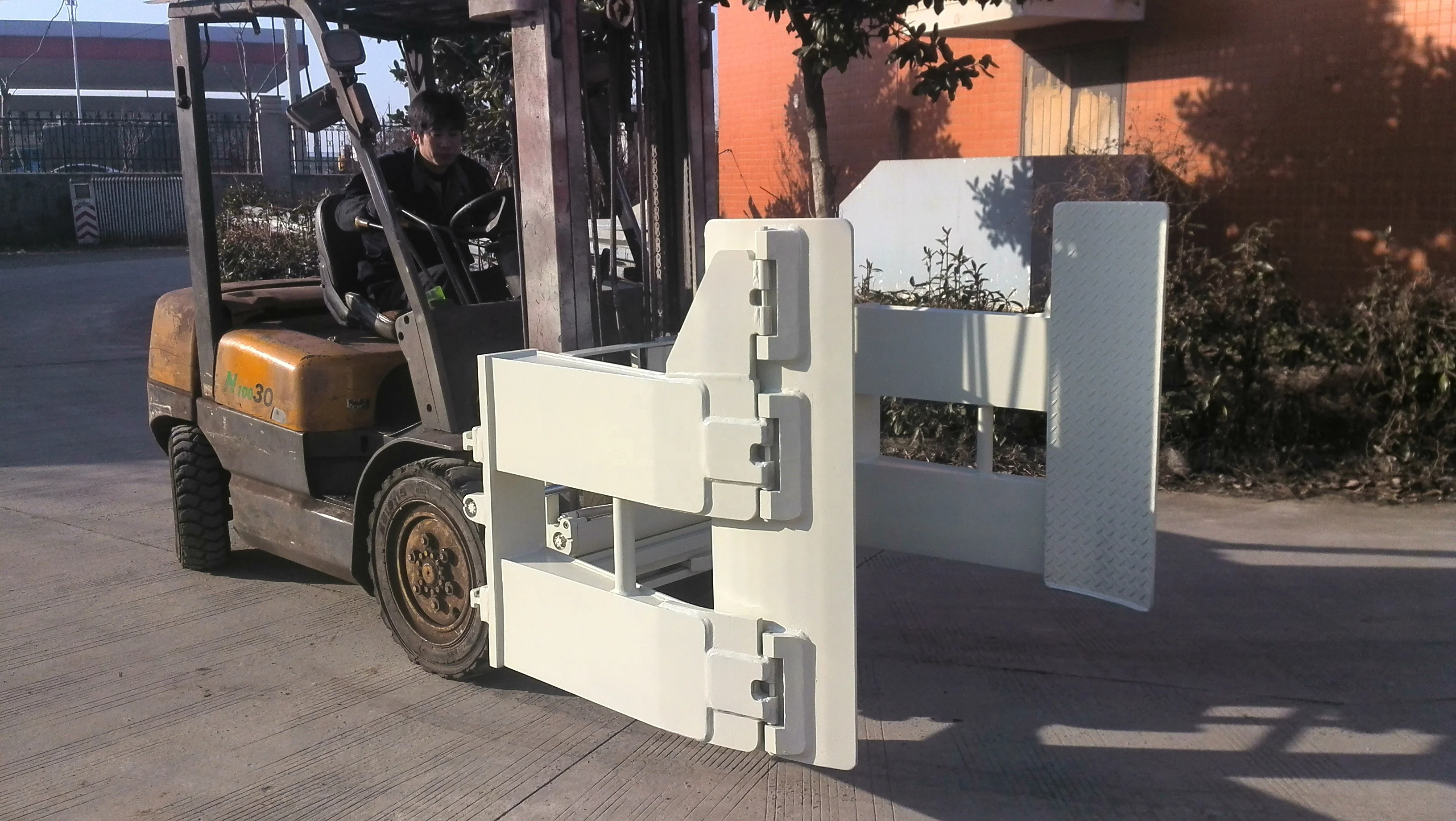 Durable tire clamps forklift attachment used in handling tire