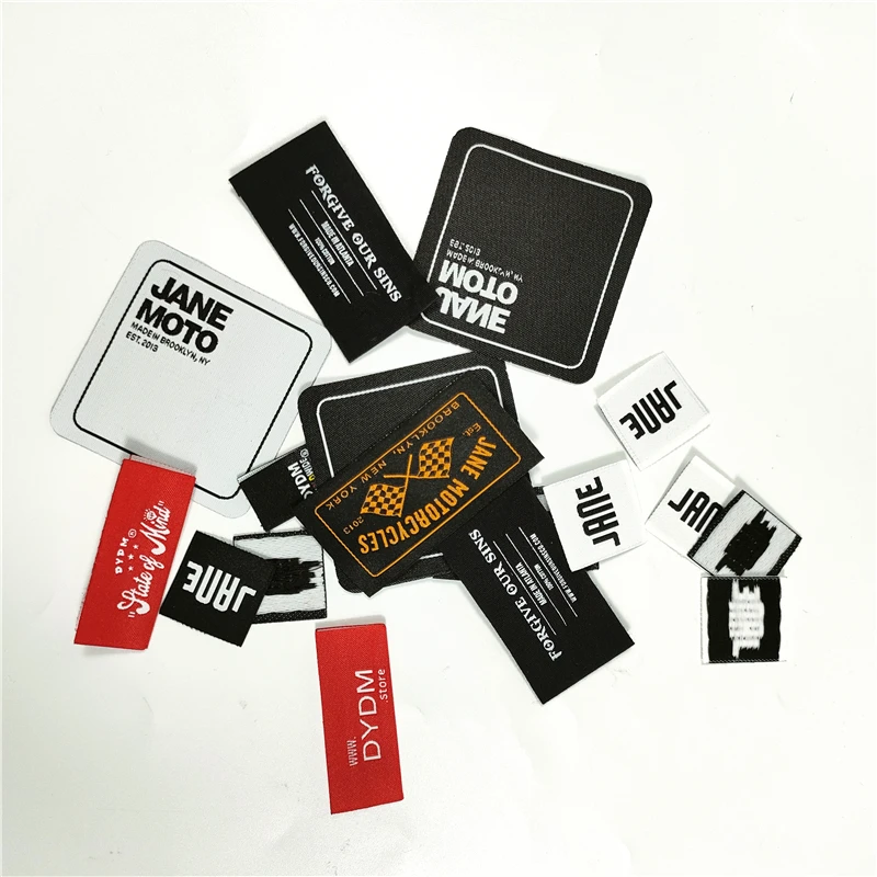 Spain wholesale nice quality blue polyester Letter Name customize designer labels for clothing Center Fold woven garment label