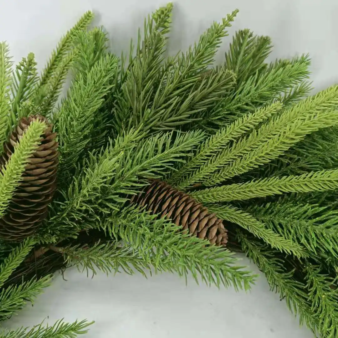 Artificial pine needles and pinecone wreath for Christmas