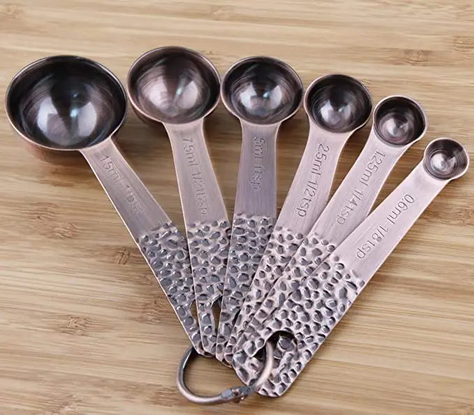  Set of 11 copper-plated stainless steel measuring cups and spoons 5 6 colored