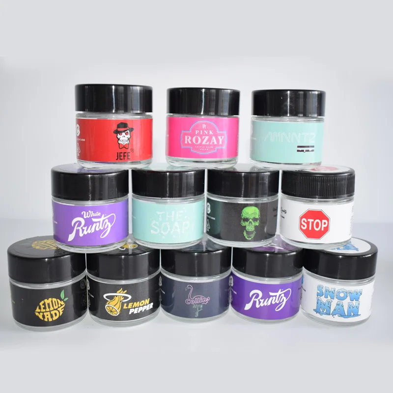 
Custom Design Food Clear Round Glass Jar For Weeds Herbs Skin Cream Bottle With Black Lid 2 Oz 