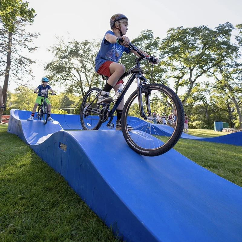 Plastic Modular Pump Track Velocity Loop 2 Is a Sequence of Roll Overs and Berms for Bikes BMX Scooters Skateboards