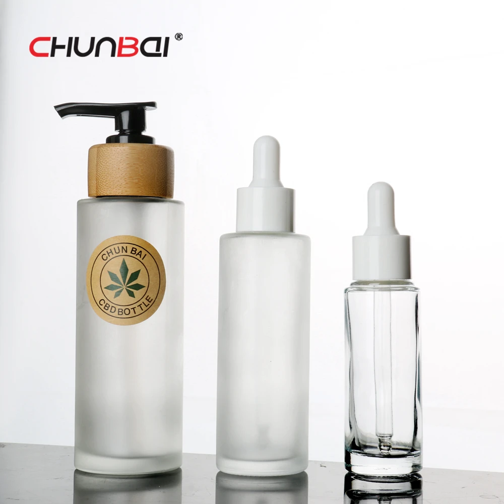 Wholesale 50ml 60ml Empty Glass Lotion Liquid Soap Pump Bottle Round Private Label Bamboo Wood Lotion Bottle