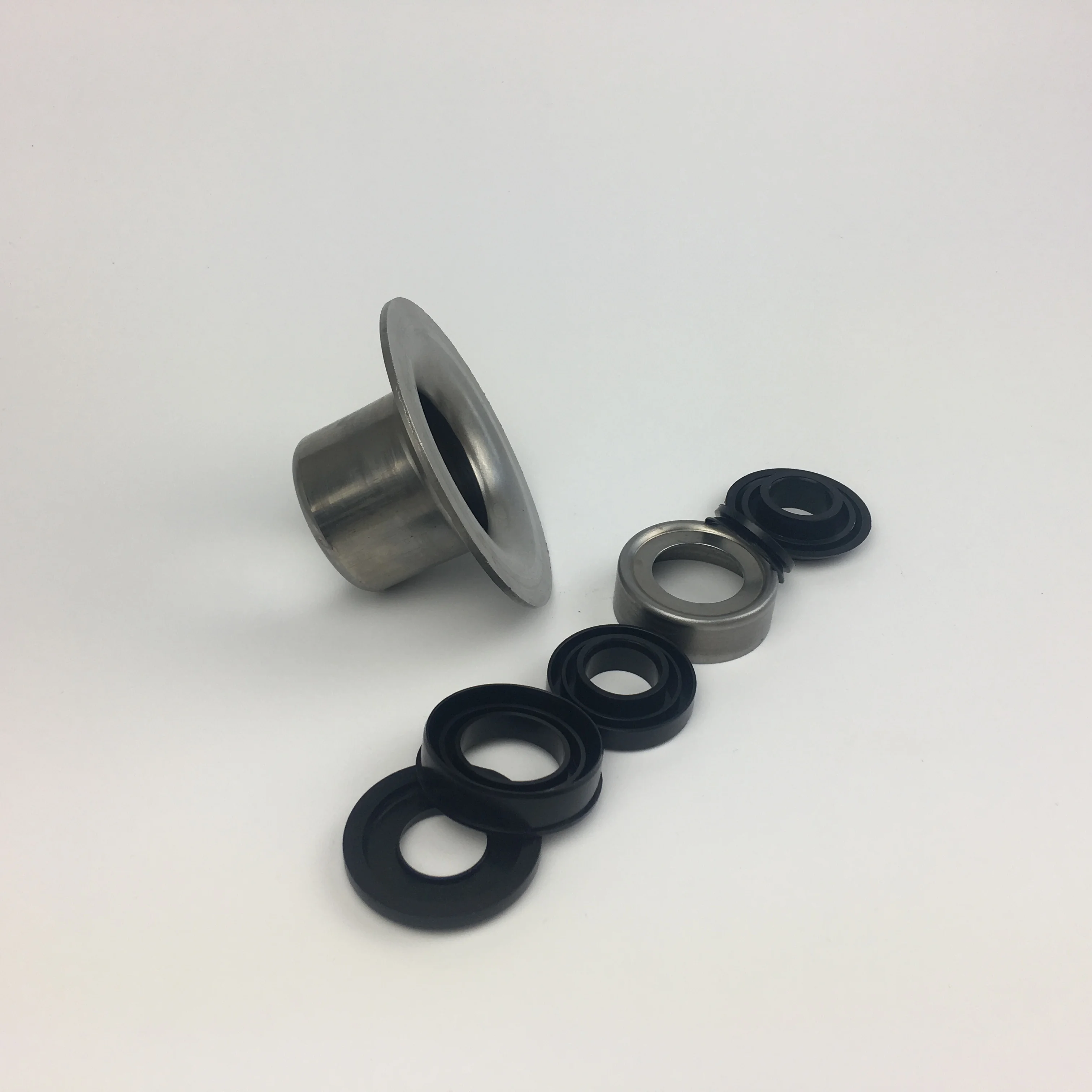 Wholesale spare parts stamping bearing housing and anti-water injection seal for idler roller