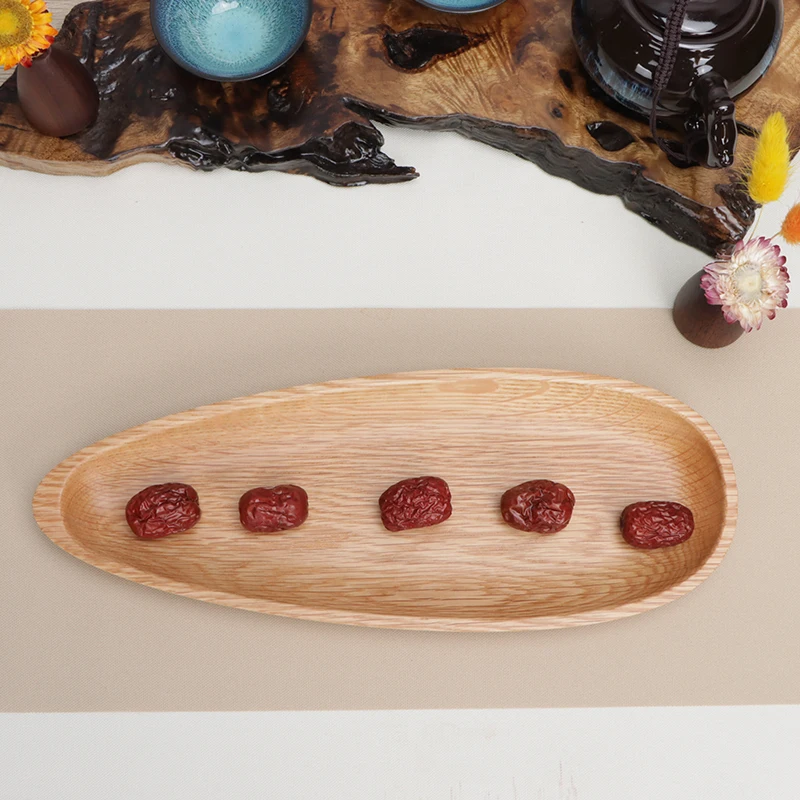 The snack tray of melon seed shaped white oak fruit plate is coated with food grade environment-friendly silicone coating