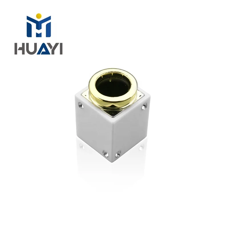 Black and white plastic cap for perfume bottle cover