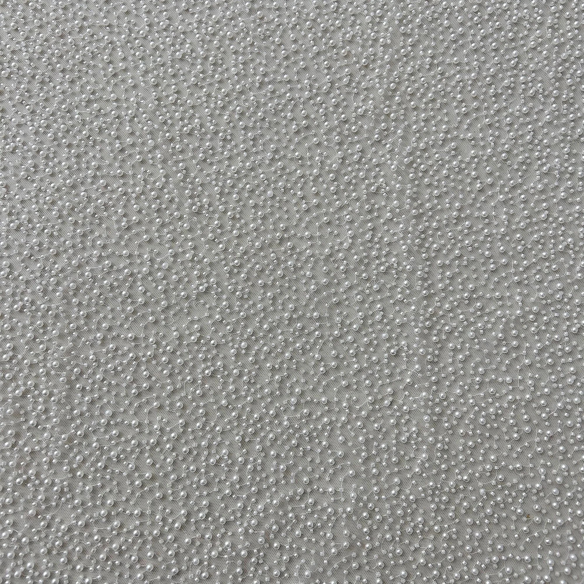 Customizable mesh fabric covered with pearls and bead tubes is suitable for wedding dresses